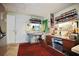 A cozy home office filled with natural light with shelving and cabinet space at 3108 Ash Ct, Dunedin, FL 34698