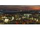 Aerial night view highlighting a cityscape with lit buildings and water features under a twilight sky at 777 N Ashley Dr # 2503, Tampa, FL 33602