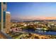 Scenic skyline view from a balcony, capturing the river, illuminated buildings, and the sunset sky at 777 N Ashley Dr # 2503, Tampa, FL 33602