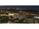 Nighttime aerial view of a vibrant city skyline with illuminated buildings and bustling highways at 777 N Ashley Dr # 2503, Tampa, FL 33602