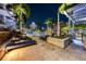 Outdoor pool area featuring lounge chairs, palm trees, and urban views, perfect for relaxation at 777 N Ashley Dr # 2503, Tampa, FL 33602