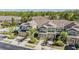 An aerial view showing the townhome's exterior, with a community pool and lots of greenery surrounding it at 12537 Silverdale St, Tampa, FL 33626
