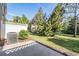 Backyard patio with a white lattice fence surrounded by lush greenery at 12537 Silverdale St, Tampa, FL 33626