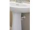 Close-up view of a white bathroom pedestal sink with chrome faucet at 12537 Silverdale St, Tampa, FL 33626