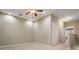 Neutral bedroom featuring carpet floors, ceiling fan, a walk-in closet and an ensuite bath at 12537 Silverdale St, Tampa, FL 33626
