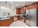 A view of the kitchen complete with stainless steel appliances, granite countertops and tile flooring at 12537 Silverdale St, Tampa, FL 33626