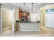 Open concept kitchen with granite counters, stainless appliances, and a view to the entry at 12537 Silverdale St, Tampa, FL 33626