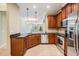 Spacious kitchen featuring dark countertops, stainless steel appliances and light wood cabinets at 12537 Silverdale St, Tampa, FL 33626