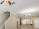 Open concept living area leading into the kitchen with a view to the entry at 12537 Silverdale St, Tampa, FL 33626