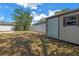 Spacious backyard with a storage shed and white privacy fence at 13851 102Nd Ave, Largo, FL 33774