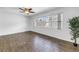 Bright, spacious bedroom featuring modern wood-look floors and a large window at 13851 102Nd Ave, Largo, FL 33774