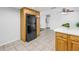 Spacious kitchen features a full-size refrigerator and expansive tile flooring at 13851 102Nd Ave, Largo, FL 33774
