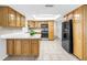 Bright and airy kitchen with wood cabinetry, white countertops, and stainless steel appliances at 13851 102Nd Ave, Largo, FL 33774