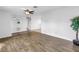 Large living room featuring modern wood flooring, a ceiling fan, and neutral decor at 13851 102Nd Ave, Largo, FL 33774