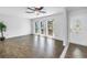 Bright living room with beautiful wood floors and large windows for ample natural light at 13851 102Nd Ave, Largo, FL 33774