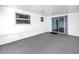 This spacious patio offers a bright, airy space with multiple windows and sliding glass doors at 13851 102Nd Ave, Largo, FL 33774