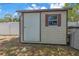 Exterior view of storage shed with window, door, and ample space for storing tools and equipment at 13851 102Nd Ave, Largo, FL 33774