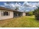Spacious backyard with a well-maintained lawn at 20 Sylvia Pl, Oldsmar, FL 34677