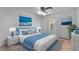 Comfortable bedroom with soft blue accents, plush bedding, and ample natural light creating a relaxing atmosphere at 20 Sylvia Pl, Oldsmar, FL 34677