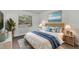 Inviting bedroom featuring a plush bed, wicker nightstands, and natural light from the window at 20 Sylvia Pl, Oldsmar, FL 34677