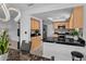 Eat-in kitchen with stainless steel appliances, black countertops, and ample cabinet space at 20 Sylvia Pl, Oldsmar, FL 34677