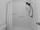 All white shower with shower head and seat at 20 Sylvia Pl, Oldsmar, FL 34677