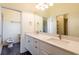 Bright bathroom with double vanity, modern fixtures, and a separate toilet area at 6816 Dali Ave # E206, Land O Lakes, FL 34637