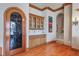 Stylish bar area with custom cabinets and marble countertop at 1097 Eden Isle Ne Dr, St Petersburg, FL 33704