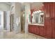 Bathroom boasts a vanity, walk-in shower, and stone tile at 1097 Eden Isle Ne Dr, St Petersburg, FL 33704