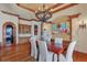 Dining room with beautiful painting and decorative chandelier at 1097 Eden Isle Ne Dr, St Petersburg, FL 33704