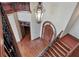 Elegant foyer featuring a grand chandelier, hardwood floors, and a custom front door at 1097 Eden Isle Ne Dr, St Petersburg, FL 33704