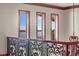 Hallway with views of the water framed by three windows at 1097 Eden Isle Ne Dr, St Petersburg, FL 33704