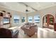 Living Room with water views, tile flooring, and elegant furnishings at 1097 Eden Isle Ne Dr, St Petersburg, FL 33704