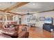 Comfortable living room with a bar, hardwood floors, and views of the water at 1097 Eden Isle Ne Dr, St Petersburg, FL 33704