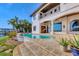 Backyard pool and patio with waterfront view at 1097 Eden Isle Ne Dr, St Petersburg, FL 33704