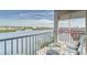 Unwind on this charming waterfront balcony with comfortable seating and a scenic water view at 19725 Gulf Blvd # 405, Indian Shores, FL 33785
