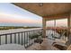 Enjoy the sunset on this waterfront balcony featuring comfortable seating and stunning water views at 19725 Gulf Blvd # 405, Indian Shores, FL 33785