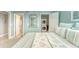 Comfortable bedroom featuring a laundry closet and a neutral color palette at 19725 Gulf Blvd # 405, Indian Shores, FL 33785