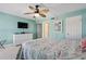 Spacious bedroom features a TV, a ceiling fan, and ample closet space at 19725 Gulf Blvd # 405, Indian Shores, FL 33785
