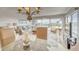 Entertain in style in this dining room with views through sliding glass doors and living space at 19725 Gulf Blvd # 405, Indian Shores, FL 33785