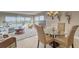 Entertain in style in this dining room with views through sliding glass doors and living space at 19725 Gulf Blvd # 405, Indian Shores, FL 33785