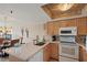 Well-equipped kitchen showcasing a breakfast bar and an efficient layout at 19725 Gulf Blvd # 405, Indian Shores, FL 33785