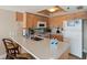 Bright kitchen features a breakfast bar, ample cabinet space, and modern appliances at 19725 Gulf Blvd # 405, Indian Shores, FL 33785