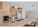 Well-lit kitchen features a breakfast bar and plenty of storage space in the cabinets at 19725 Gulf Blvd # 405, Indian Shores, FL 33785