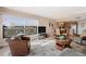 Inviting living area with a large window, comfortable seating, and adjacent dining space at 19725 Gulf Blvd # 405, Indian Shores, FL 33785