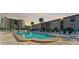 Exterior view of a community swimming pool with surrounding lounge area at 19725 Gulf Blvd # 405, Indian Shores, FL 33785
