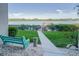 Scenic view with a bench overlooking a walkway and body of water at 19725 Gulf Blvd # 405, Indian Shores, FL 33785