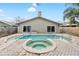 Relaxing backyard features a sparkling pool and spa, perfect for outdoor entertaining and enjoying warm sunny days at 210 Lee St, Oldsmar, FL 34677