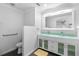Contemporary bathroom with dual sinks, glass countertop, and stylish tile floor at 210 Lee St, Oldsmar, FL 34677