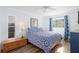 Cozy bedroom with natural light and a comfortable bed and furnishings at 210 Lee St, Oldsmar, FL 34677